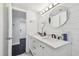 Bathroom vanity with marble countertop, dual sinks, and modern fixtures with a bright white interior at 345 S Mcmullen Booth Rd # 142, Clearwater, FL 33759