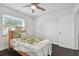 A bedroom with a ceiling fan and a bright, sunny window at 345 S Mcmullen Booth Rd # 142, Clearwater, FL 33759