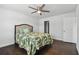 Bright bedroom with dark hardwood floors, ceiling fan and tropical themed bedding at 345 S Mcmullen Booth Rd # 142, Clearwater, FL 33759