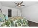Bedroom with tropical themed bedding, dark hardwood floors, ceiling fan at 345 S Mcmullen Booth Rd # 142, Clearwater, FL 33759