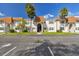 Exterior of building with parking spots, grass and palm trees at 345 S Mcmullen Booth Rd # 142, Clearwater, FL 33759