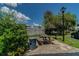 Picnic area with a grill, picnic table, trash receptacle, lamppost, and lush green landscaping at 345 S Mcmullen Booth Rd # 142, Clearwater, FL 33759
