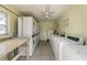 On-site laundry room featuring multiple washers and dryers for tenant convenience at 345 S Mcmullen Booth Rd # 142, Clearwater, FL 33759