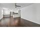 An open floor plan with hardwood floors connects the living area to a stylish, modern kitchen at 345 S Mcmullen Booth Rd # 142, Clearwater, FL 33759