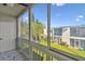 Screened patio with views of the building and landscaping at 345 S Mcmullen Booth Rd # 142, Clearwater, FL 33759