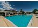 Large outdoor swimming pool with clear blue water and a view of the clubhouse at 345 S Mcmullen Booth Rd # 142, Clearwater, FL 33759