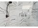 Modern bathroom shower with marble-style tile and sleek fixtures at 345 S Mcmullen Booth Rd # 142, Clearwater, FL 33759
