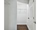 Bright walk-in closet with wire shelving and hardwood floors is ready for easy organization at 345 S Mcmullen Booth Rd # 142, Clearwater, FL 33759