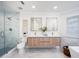 Bathroom featuring double vanity, glass shower, and modern fixtures at 35 Deerpath Dr, Oldsmar, FL 34677