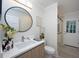 Bright bathroom featuring a vanity, glass shower, and modern fixtures at 35 Deerpath Dr, Oldsmar, FL 34677