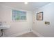 Bright laundry room with a window, sink, and washer/dryer hookups, perfect for convenient chores at 35 Deerpath Dr, Oldsmar, FL 34677