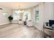 Bright living room with wood floors, modern lighting, and large windows at 35 Deerpath Dr, Oldsmar, FL 34677