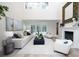 Living room with high ceilings, fireplace, and sliding doors that open to a pool view at 35 Deerpath Dr, Oldsmar, FL 34677