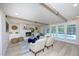Inviting living room with a fireplace, neutral decor, and access to the outdoor pool area at 35 Deerpath Dr, Oldsmar, FL 34677