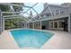 Screened in pool area featuring an inground pool and an outdoor living space at 35 Deerpath Dr, Oldsmar, FL 34677