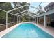 Large screened in pool area featuring a swimming pool and outdoor seating at 35 Deerpath Dr, Oldsmar, FL 34677