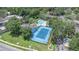 Aerial view showing community tennis court and pool at 4014 Dream Oak Pl # 202, Tampa, FL 33613