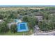 Aerial view showing community tennis court and pool at 4014 Dream Oak Pl # 202, Tampa, FL 33613