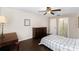 Cozy bedroom with wood floors, ceiling fan, and ensuite bathroom at 4014 Dream Oak Pl # 202, Tampa, FL 33613