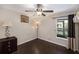 Comfortable bedroom featuring dark wood floors, a ceiling fan, and natural light at 4014 Dream Oak Pl # 202, Tampa, FL 33613