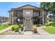 Exterior shot of the condo showing the stairs leading to the second floor units and well-maintained landscaping at 4014 Dream Oak Pl # 202, Tampa, FL 33613