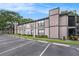 Exterior elevation of a multi-Gathering dwelling with lush landscaping and on-site parking at 4014 Dream Oak Pl # 202, Tampa, FL 33613