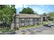 Elevated view of a multi-Gathering dwelling with lush landscaping and on-site parking at 4014 Dream Oak Pl # 202, Tampa, FL 33613