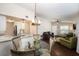 Bright open concept living room with modern chandelier, hardwood floors, and comfortable seating at 4014 Dream Oak Pl # 202, Tampa, FL 33613