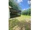 Spacious backyard featuring a screened-in lanai perfect for outdoor relaxation and entertaining at 4639 Cabbage Palm Dr, Valrico, FL 33596