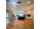 Bright kitchen featuring a stainless steel refrigerator, hardwood floors, and ample cabinet space at 4639 Cabbage Palm Dr, Valrico, FL 33596