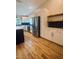 Modern kitchen with stainless steel appliances, and a central island featuring a breakfast bar at 4639 Cabbage Palm Dr, Valrico, FL 33596
