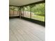 Relax on this tiled screened porch with views of the fenced backyard and tranquil pond at 4639 Cabbage Palm Dr, Valrico, FL 33596