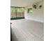 This screened porch has tiled flooring and a window, perfect for outdoor relaxation at 4639 Cabbage Palm Dr, Valrico, FL 33596