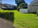 Lush green backyard featuring a well-maintained lawn and privacy fence at 5100 Burchette Rd # 1304, Tampa, FL 33647