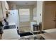 Functional kitchen with tile floors, neutral cabinets, and stainless steel sink at 5100 Burchette Rd # 1304, Tampa, FL 33647