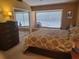 Inviting main bedroom featuring neutral walls, a large window and mirrored closet doors at 5100 Burchette Rd # 1304, Tampa, FL 33647