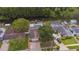 Aerial view of a home with a private pool and lush landscaping, showcasing outdoor living spaces and neighborhood at 516 7Th Se St, Largo, FL 33771