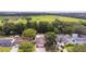 Aerial view of neighborhood featuring mature trees, waterfront properties, and green space at 516 7Th Se St, Largo, FL 33771