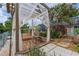 Backyard wooden pergola with views of lush landscaping and a waterfront canal at 516 7Th Se St, Largo, FL 33771