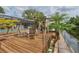 Spacious wood deck with outdoor seating by the water's edge at 516 7Th Se St, Largo, FL 33771
