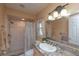 Full bathroom features updated vanity and a shower with a shower curtain and updated fixtures at 516 7Th Se St, Largo, FL 33771
