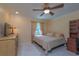 Cozy bedroom with neutral tones, natural light from the window and tile flooring at 516 7Th Se St, Largo, FL 33771
