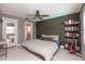 Comfortable bedroom features neutral colors, a ceiling fan, and adjoined ensuite bathroom at 516 7Th Se St, Largo, FL 33771