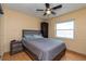 Bedroom with wood laminate flooring, neutral paint color, a ceiling fan and lots of natural light at 516 7Th Se St, Largo, FL 33771