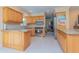 Updated kitchen with wood cabinets, granite countertops, and stainless steel appliances for modern living at 516 7Th Se St, Largo, FL 33771