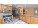 Updated kitchen boasts stainless steel appliances, granite countertops and beautiful wood cabinets at 516 7Th Se St, Largo, FL 33771