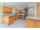 Beautiful kitchen with wood cabinets, stainless steel appliances, granite countertops, and tile backsplash at 516 7Th Se St, Largo, FL 33771
