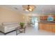 Inviting living room with tile floors, modern furniture, and view to the kitchen and dining area at 516 7Th Se St, Largo, FL 33771