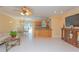 Cozy living room featuring tile flooring, neutral paint, and seamless integration with the kitchen at 516 7Th Se St, Largo, FL 33771