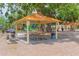 Covered picnic shelter with tables, creating an ideal space for gatherings and outdoor dining within the community park at 516 7Th Se St, Largo, FL 33771